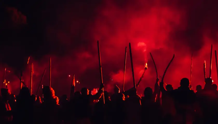 A medieval troop on the battlefield at night. Silhouettes of the